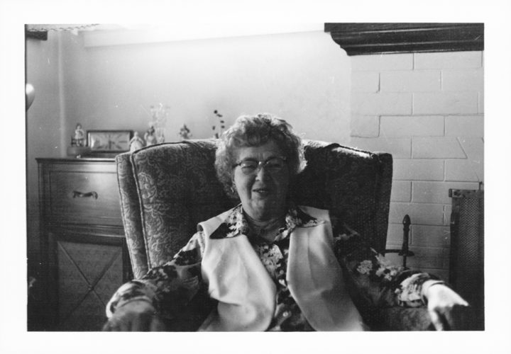 Smiling senior woman in armchair