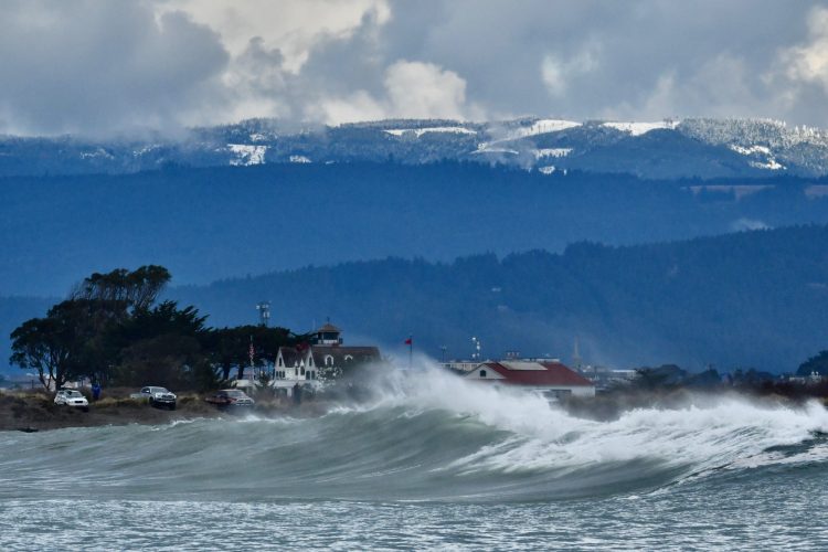 Winter breakers in the channel with Coast Guard Station in the background (Photo by Rick Urban)